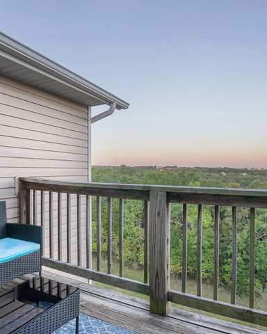 Private deck overlooking the Ozark hills at sunset in Branson